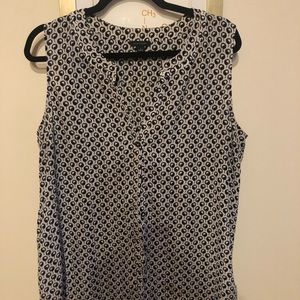 Sleeveless white and navy blue button-down.